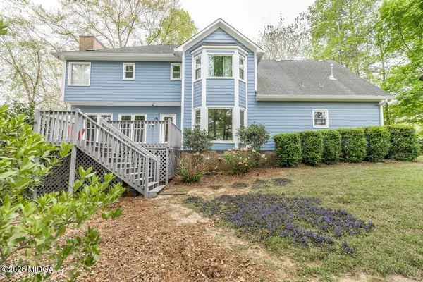 a house with trees in front of it