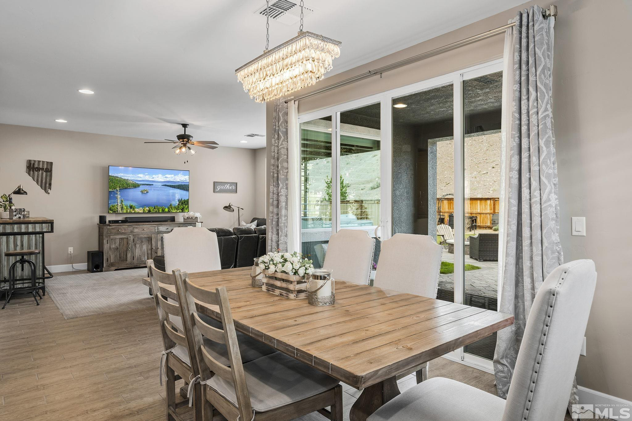 3325 Show Jumper Lane Reno, NV 89521 - Photo 7 of 34 a view of a dining room with furniture window and wooden floor