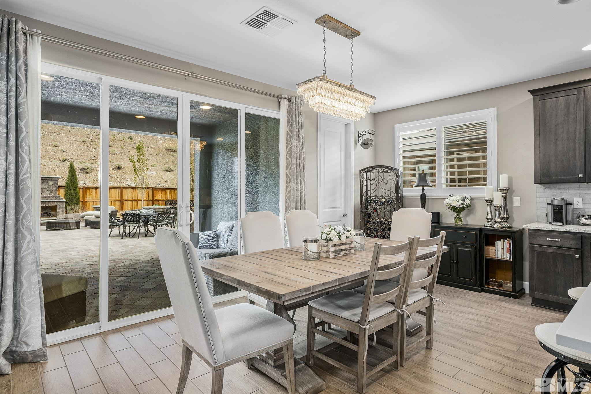 3325 Show Jumper Lane Reno, NV 89521 - Photo 8 of 34 a view of a dining room with furniture window and outside view