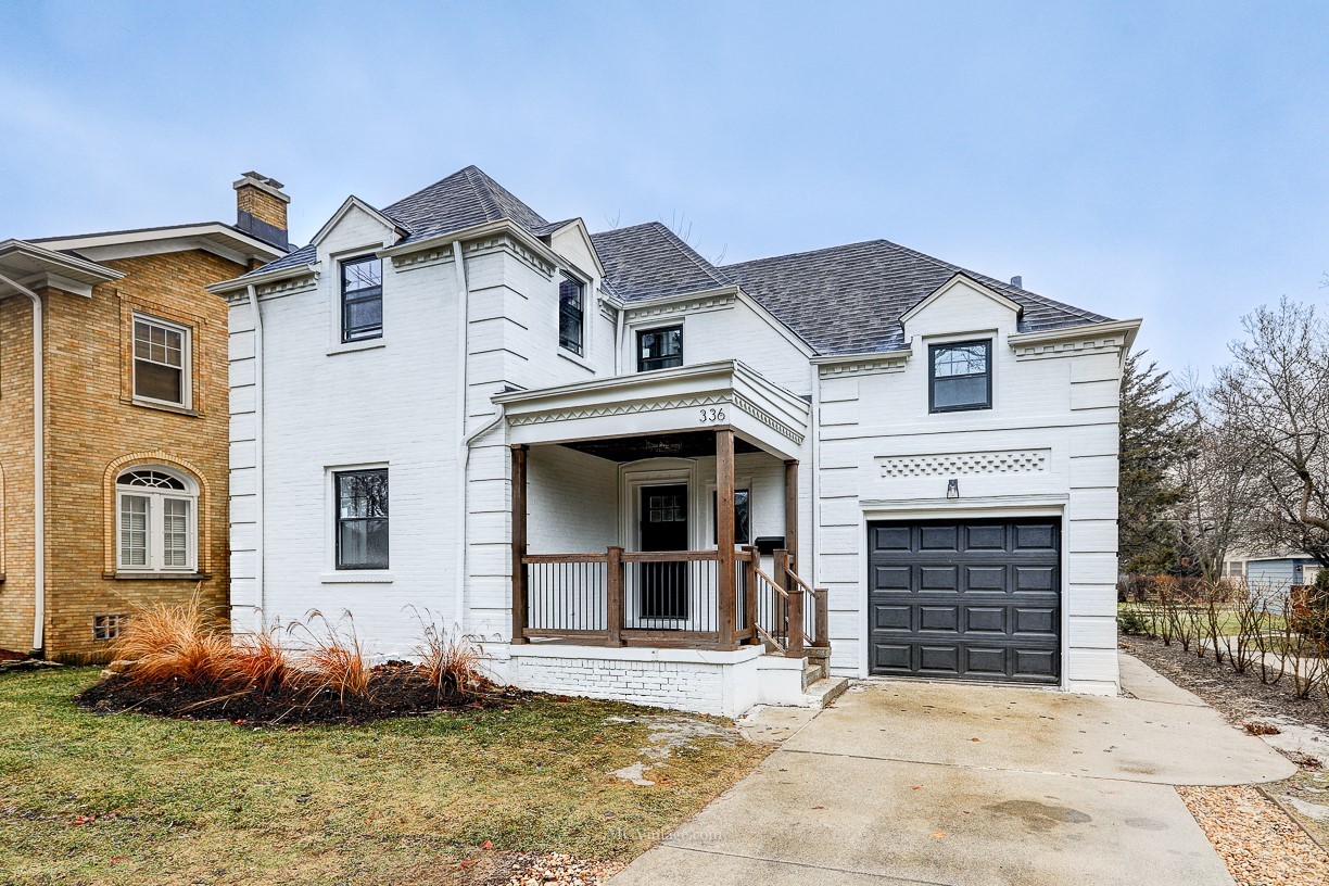 336 Nuttall Road Riverside, IL 60546 - Photo 1 of 34 a front view of a house with garden