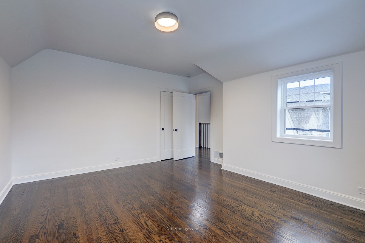 336 Nuttall Road Riverside, IL 60546 - Photo 20 of 34 an empty room with wooden floor and windows