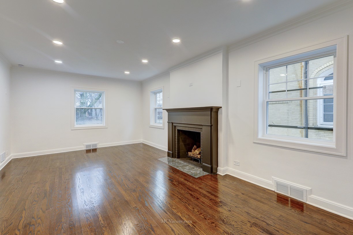336 Nuttall Road Riverside, IL 60546 - Photo 6 of 34 a view of an empty room with wooden floor and a window