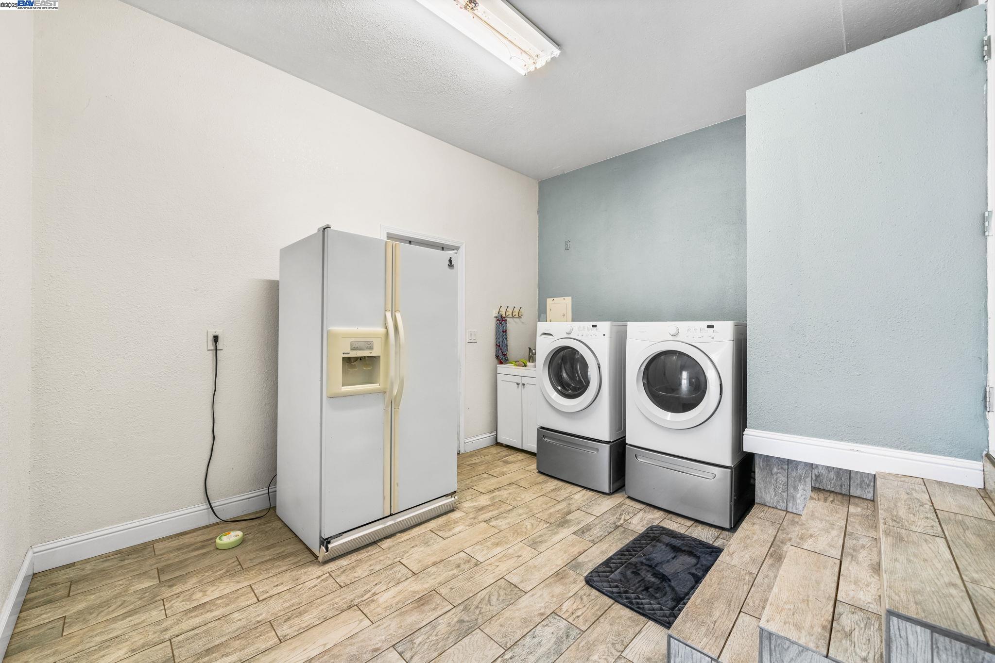 26928 Palomares Road Castro Valley, CA 94552 - Photo 38 of 58 a utility room with dryer and washer