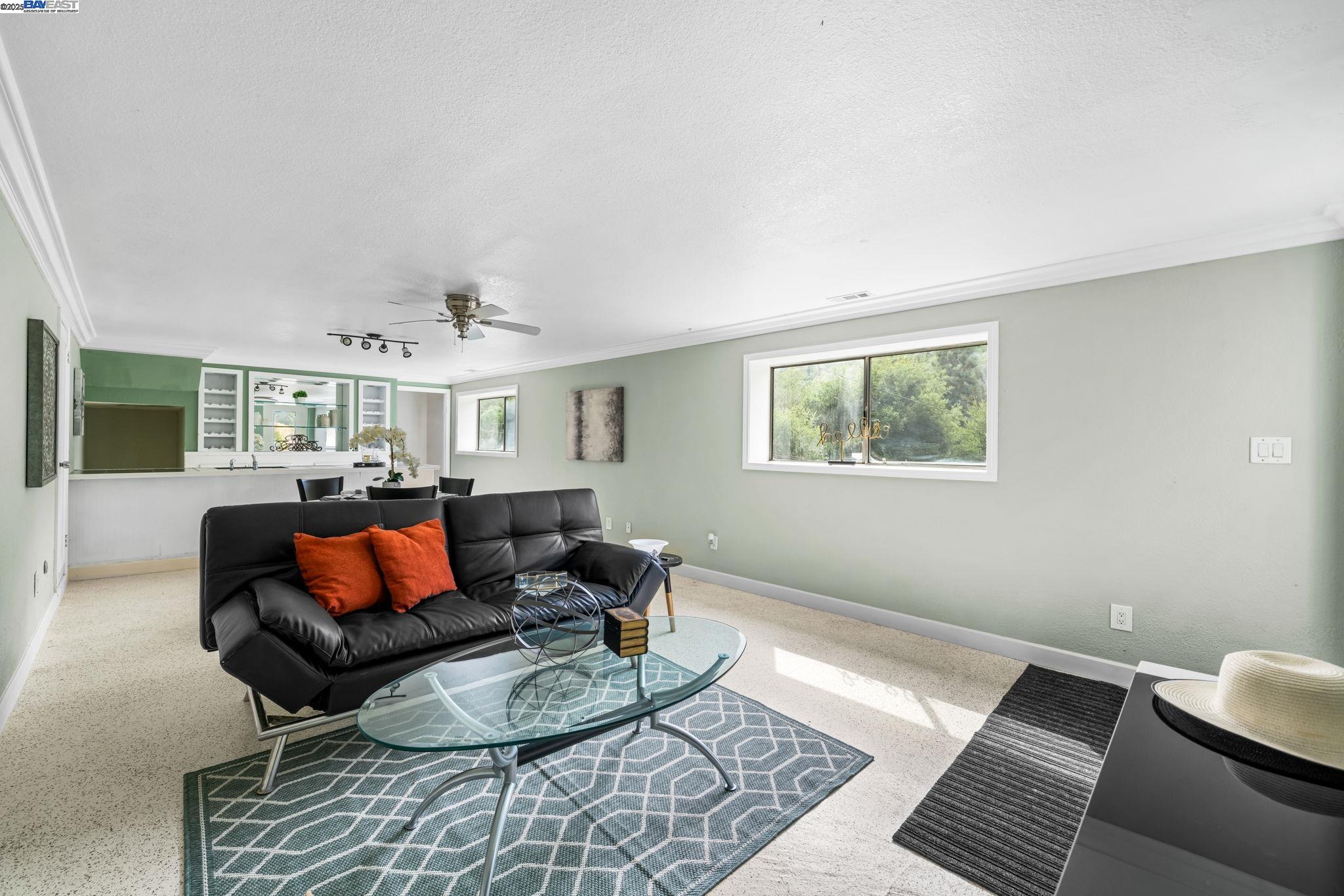 26928 Palomares Road Castro Valley, CA 94552 - Photo 41 of 58 a living room with furniture and a rug