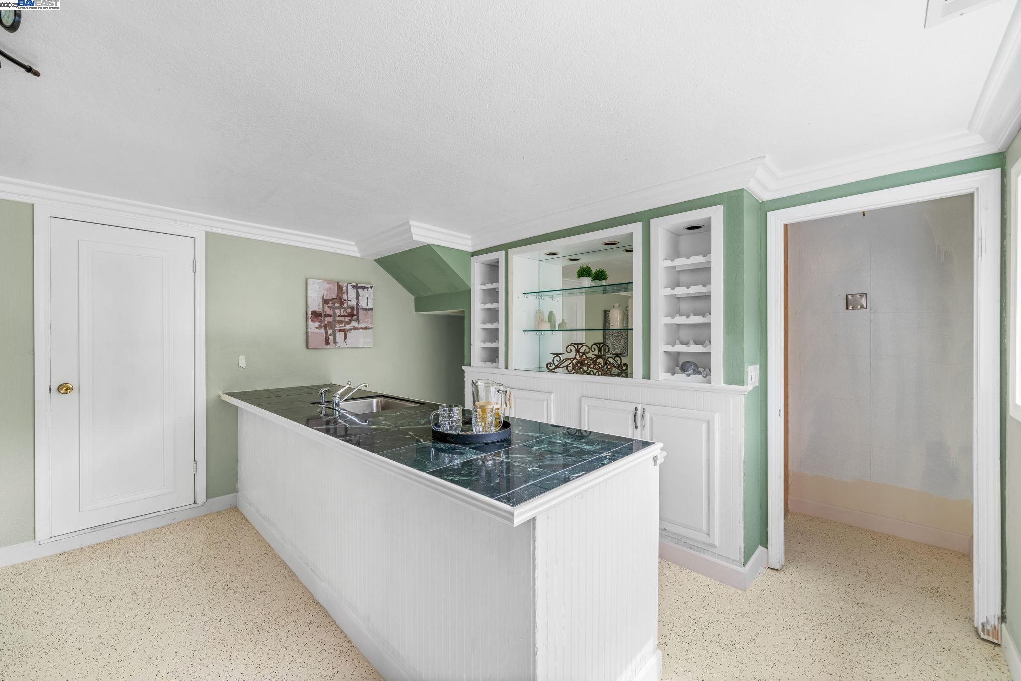 26928 Palomares Road Castro Valley, CA 94552 - Photo 44 of 58 a kitchen with granite countertop a sink and a granite counter tops