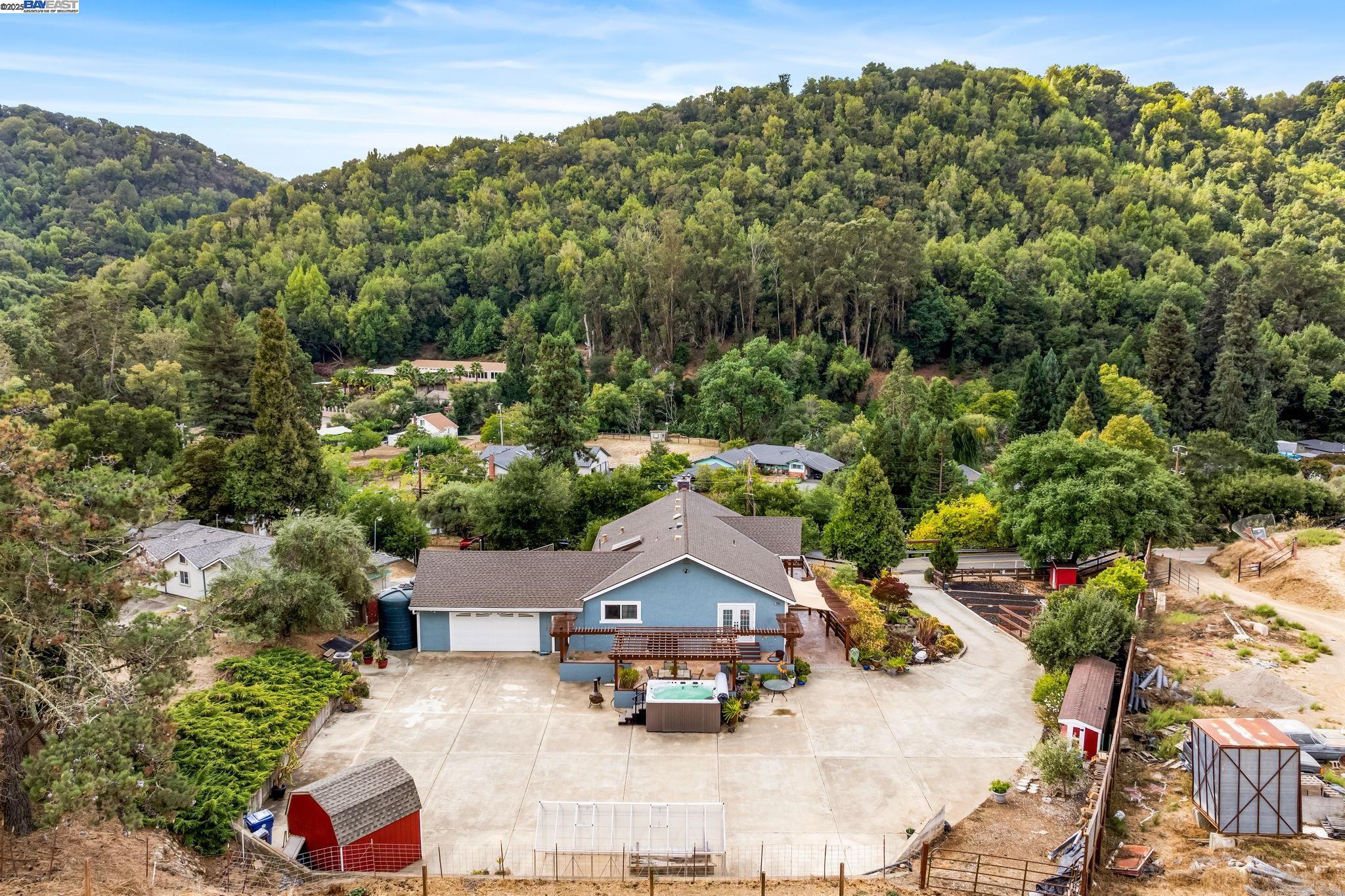 26928 Palomares Road Castro Valley, CA 94552 - Photo 7 of 58 an aerial view of a house with yard swimming pool and mountain view