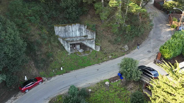 an aerial view of a house with a yard