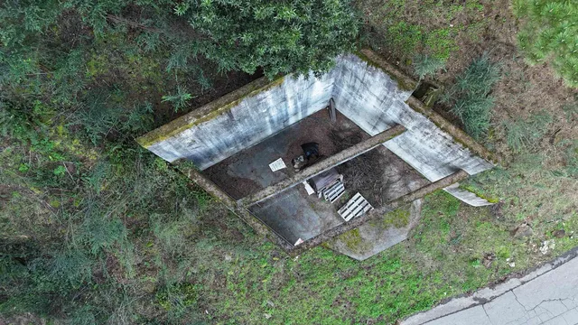 a backyard of a house with a yard and outdoor seating