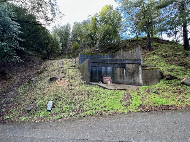 a view of a chairs and fire pit in the yard