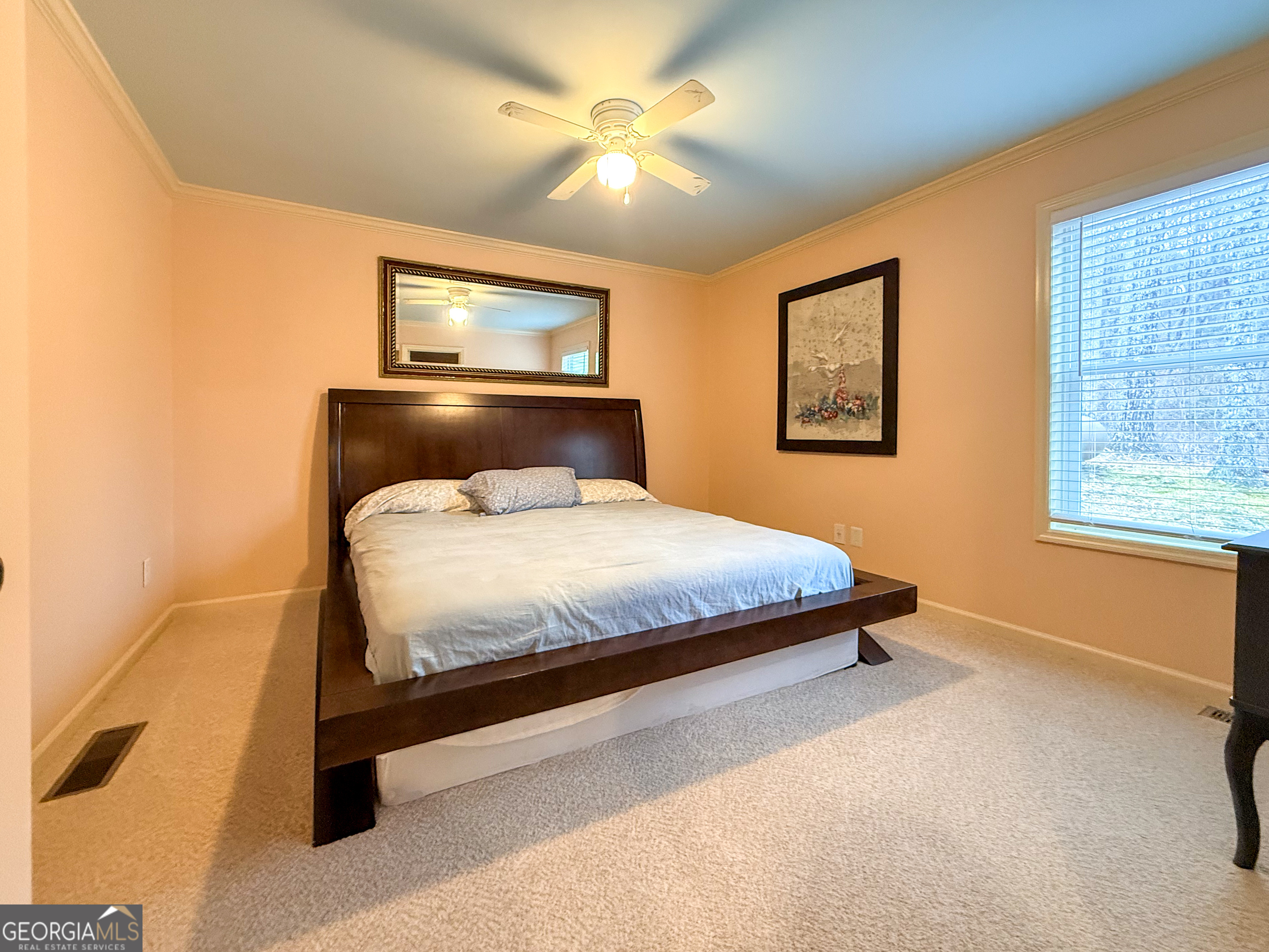 406 Yonah Mountain Road Cleveland, GA 30528 - Photo 13 of 65 a bedroom with a bed and a chandelier