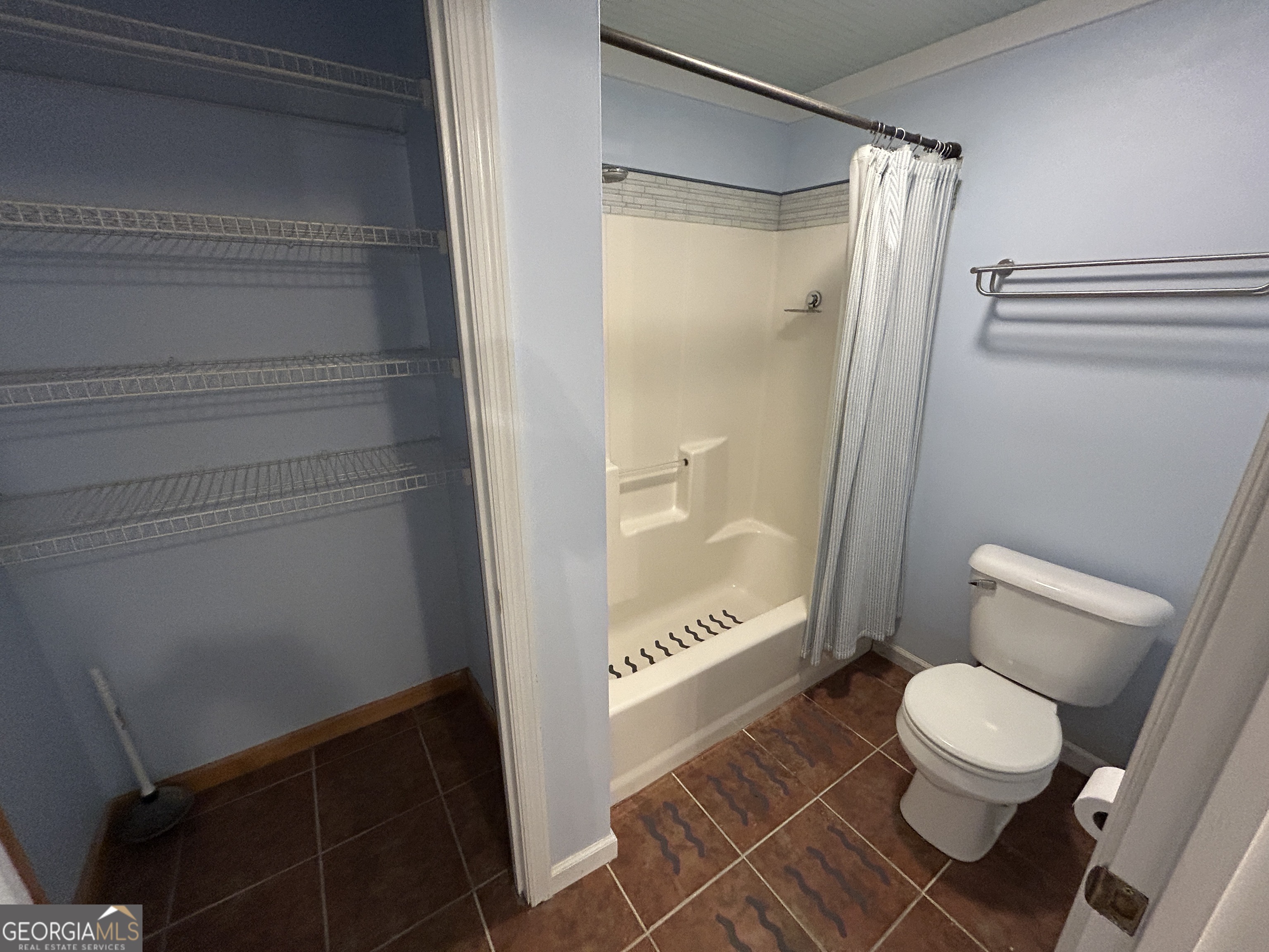 406 Yonah Mountain Road Cleveland, GA 30528 - Photo 43 of 65 a bathroom with a toilet and a shower