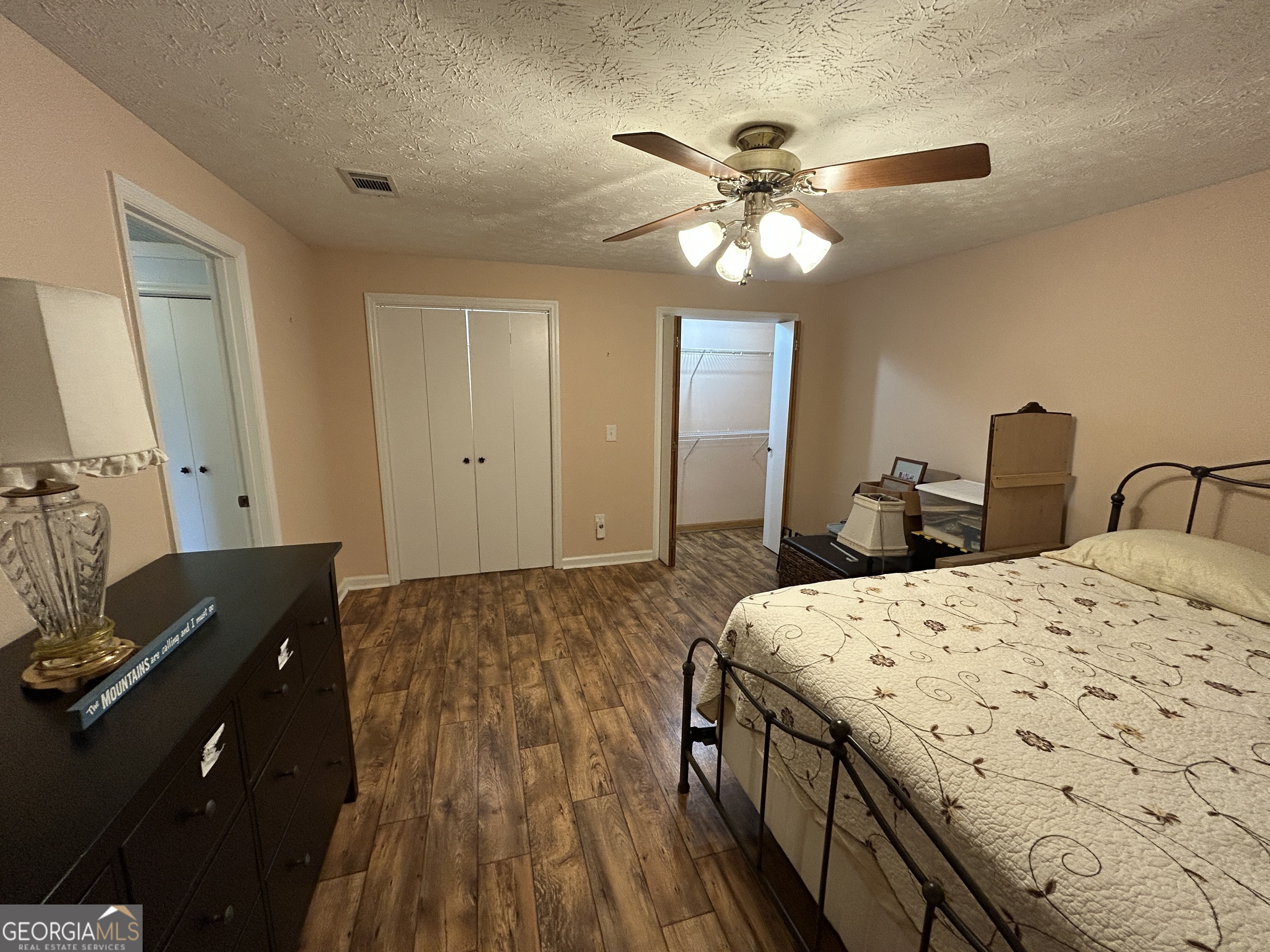 406 Yonah Mountain Road Cleveland, GA 30528 - Photo 47 of 65 a spacious bedroom with a bed and a dresser