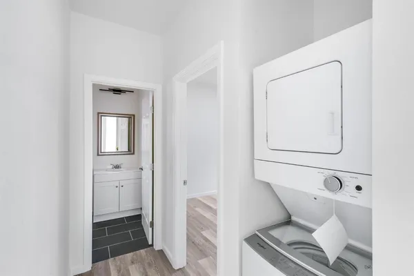 a bathroom with a toilet sink and a mirror
