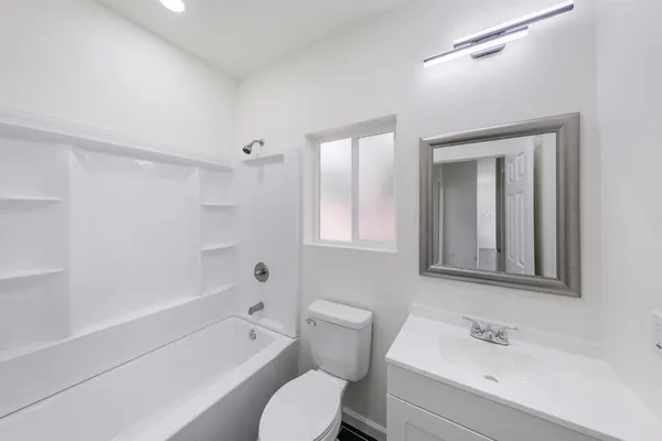 a bathroom with a toilet sink and bathtub
