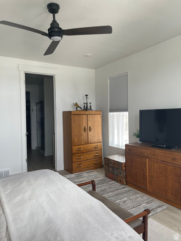 655 Oliver Road Tooele, UT 84074 - Photo 9 of 21 Modern ceiling fan with dark wood-finish blades and integrated lighting