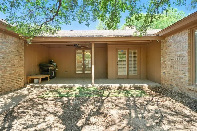 a view of a livingroom with furniture and chandelier