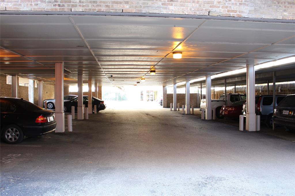 715 West 22 1/2 Street, Unit 101 Austin, TX 78705 - Photo 13 of 13 a view of parking garage with cars
