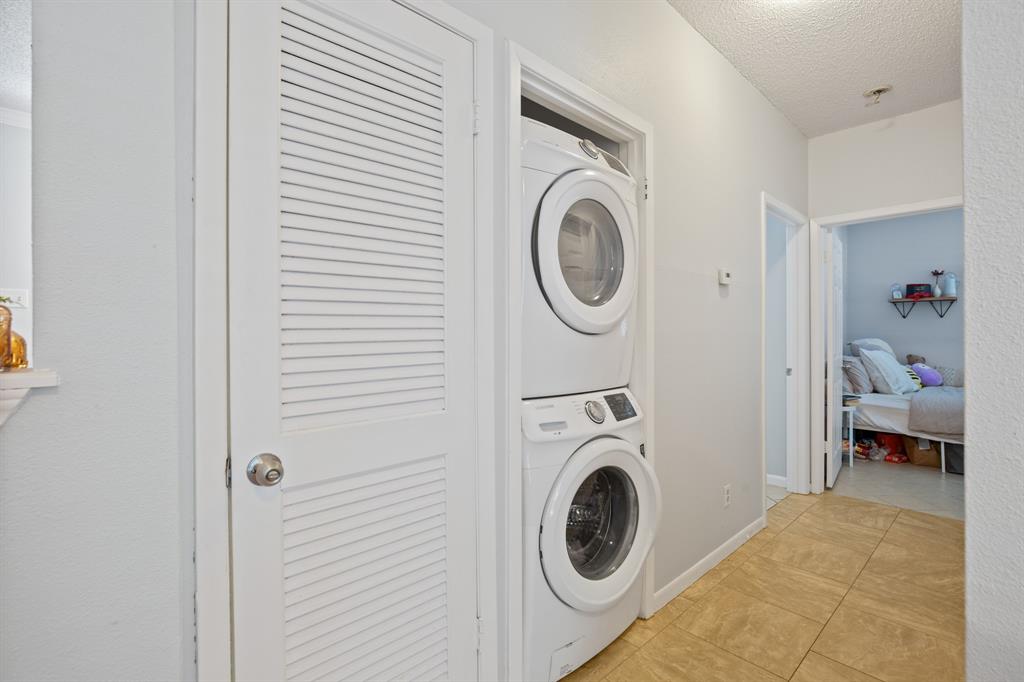 715 West 22 1/2 Street, Unit 101 Austin, TX 78705 - Photo 8 of 13 a utility room with dryer and washer