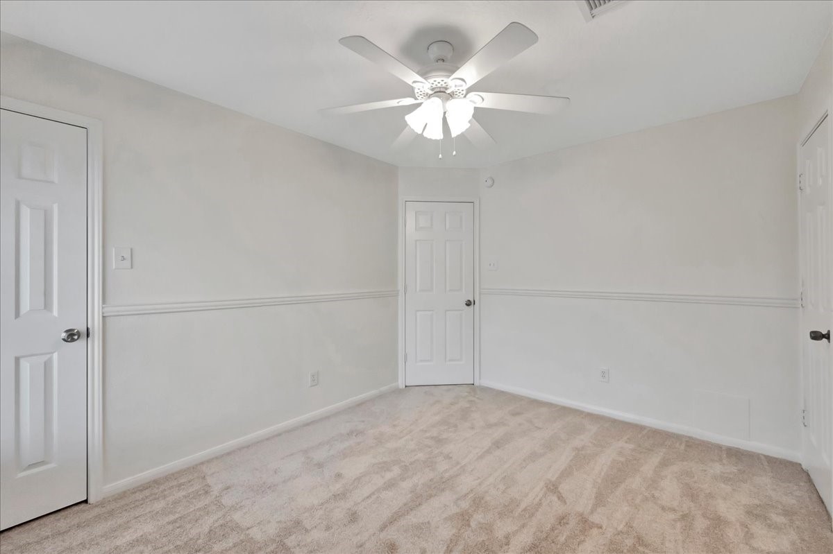 14010 Hazel Ridge Court Houston, TX 77062 - Photo 29 of 38 Bedroom 3 has a walk-in closet (on left) and a full size attic entry door with lockable knob to the right. Exit door is in the center.