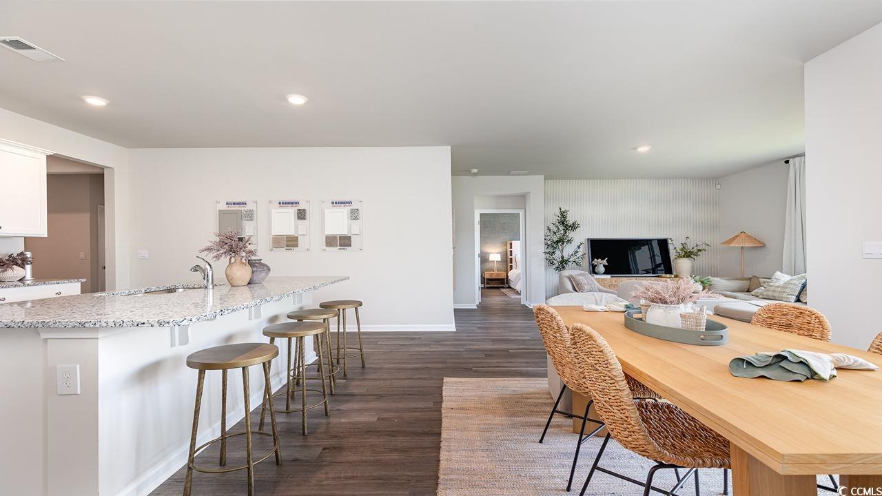 7350 Meadow Walk Loop Loris, SC 29569 - Photo 15 of 26 Dining area featuring dark hardwood / wood-style flooring and sink