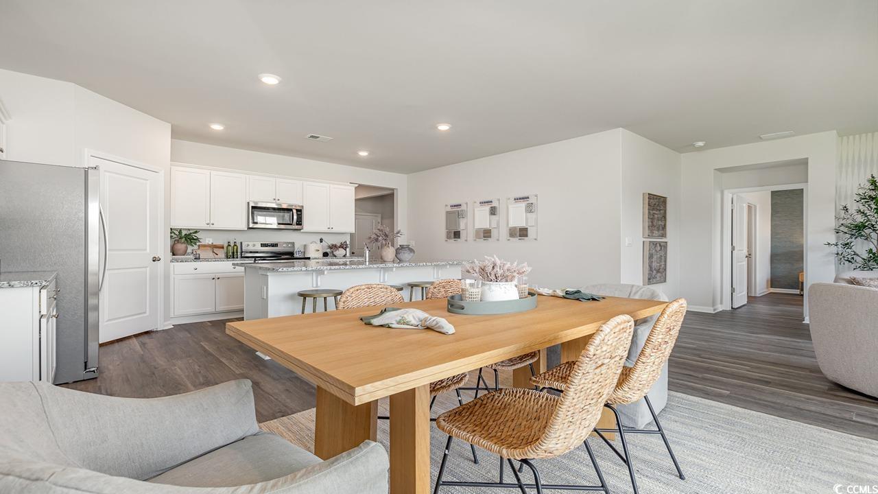 7350 Meadow Walk Loop Loris, SC 29569 - Photo 16 of 26 Dining space with hardwood / wood-style floors