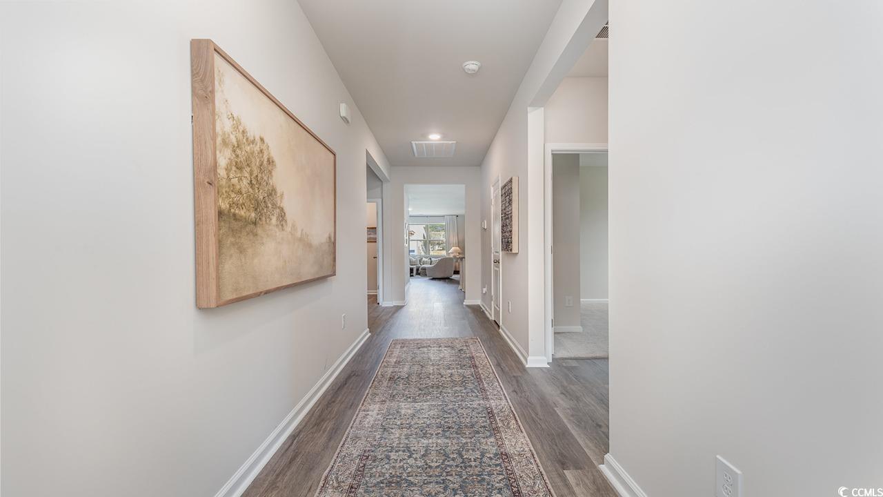 7350 Meadow Walk Loop Loris, SC 29569 - Photo 2 of 26 Hallway featuring dark hardwood / wood-style floors
