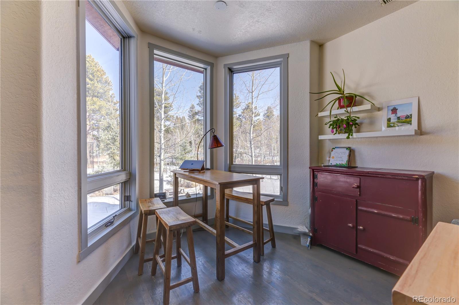 186 Thunder Ridge Road South Nederland, CO 80466 - Photo 18 of 50 a view of a workspace with furniture and a window
