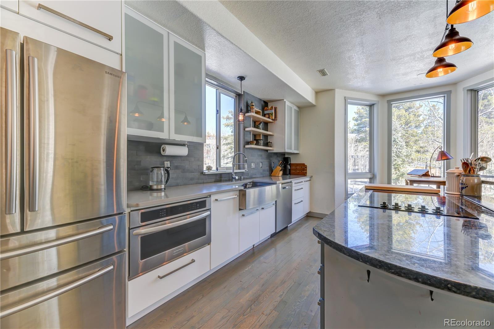186 Thunder Ridge Road South Nederland, CO 80466 - Photo 21 of 50 a kitchen with a refrigerator and a stove