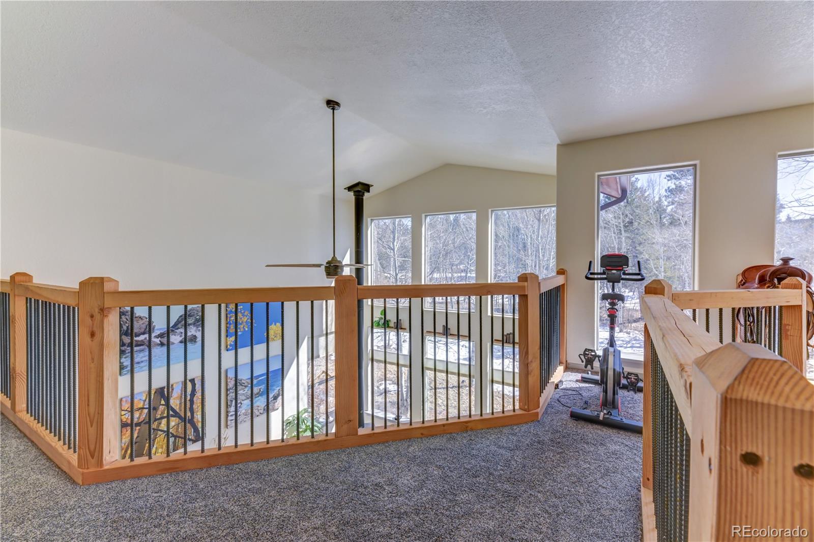 186 Thunder Ridge Road South Nederland, CO 80466 - Photo 26 of 50 a view of an empty room with window and hardwood floor