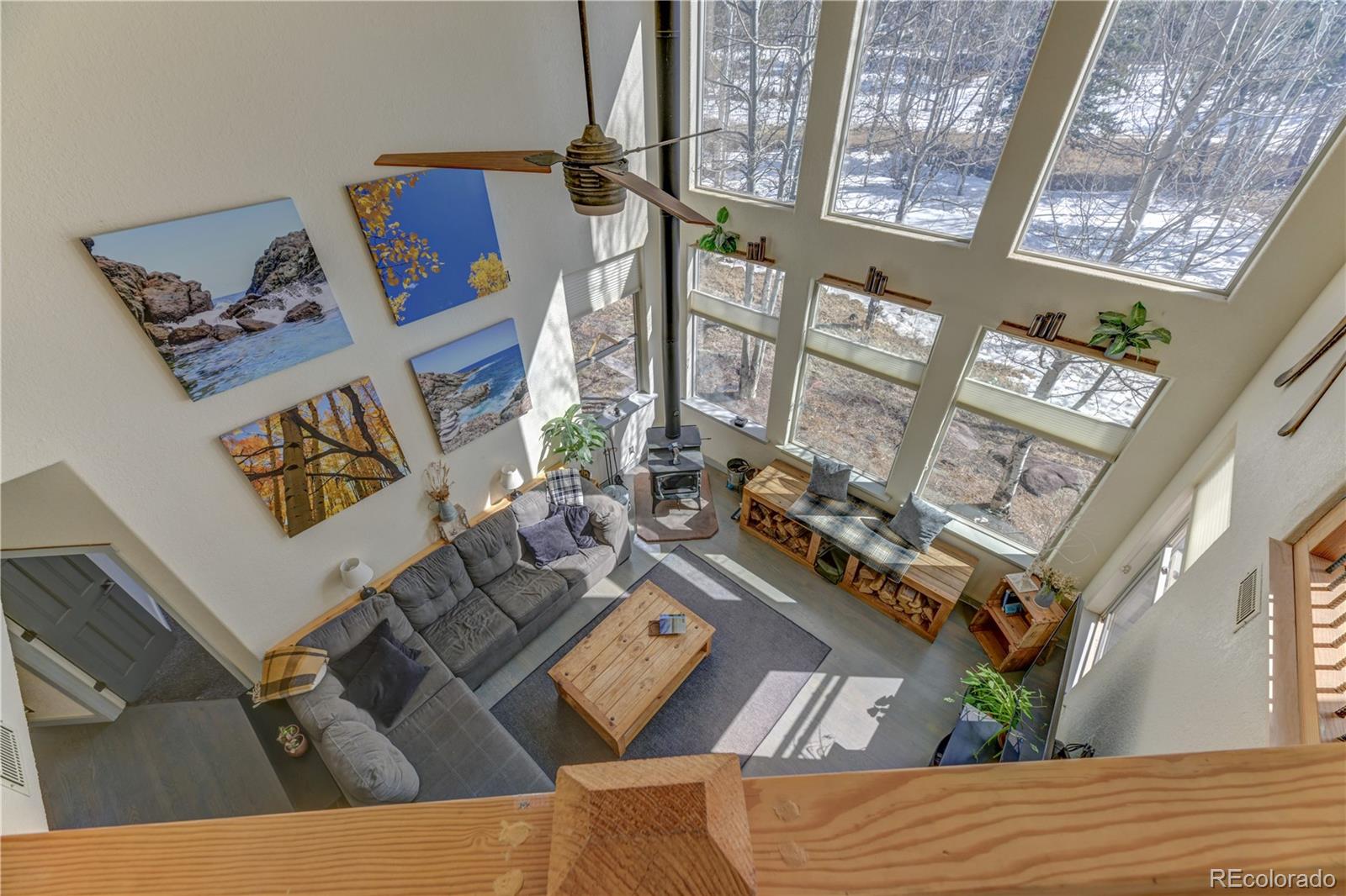186 Thunder Ridge Road South Nederland, CO 80466 - Photo 29 of 50 a view of living room with furniture and floor to ceiling windows