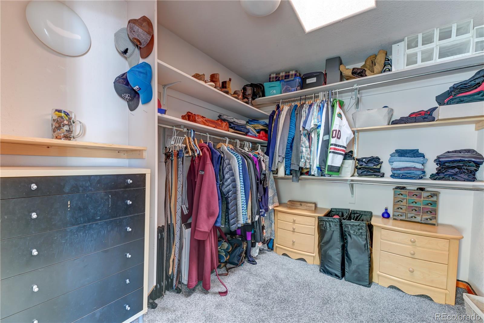 186 Thunder Ridge Road South Nederland, CO 80466 - Photo 36 of 50 a view of walk in closet with clothes and shoes