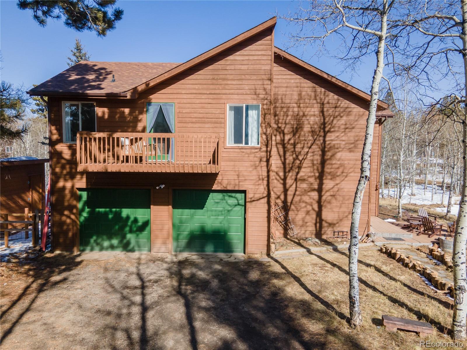 186 Thunder Ridge Road South Nederland, CO 80466 - Photo 5 of 50 a front view of a house with a yard
