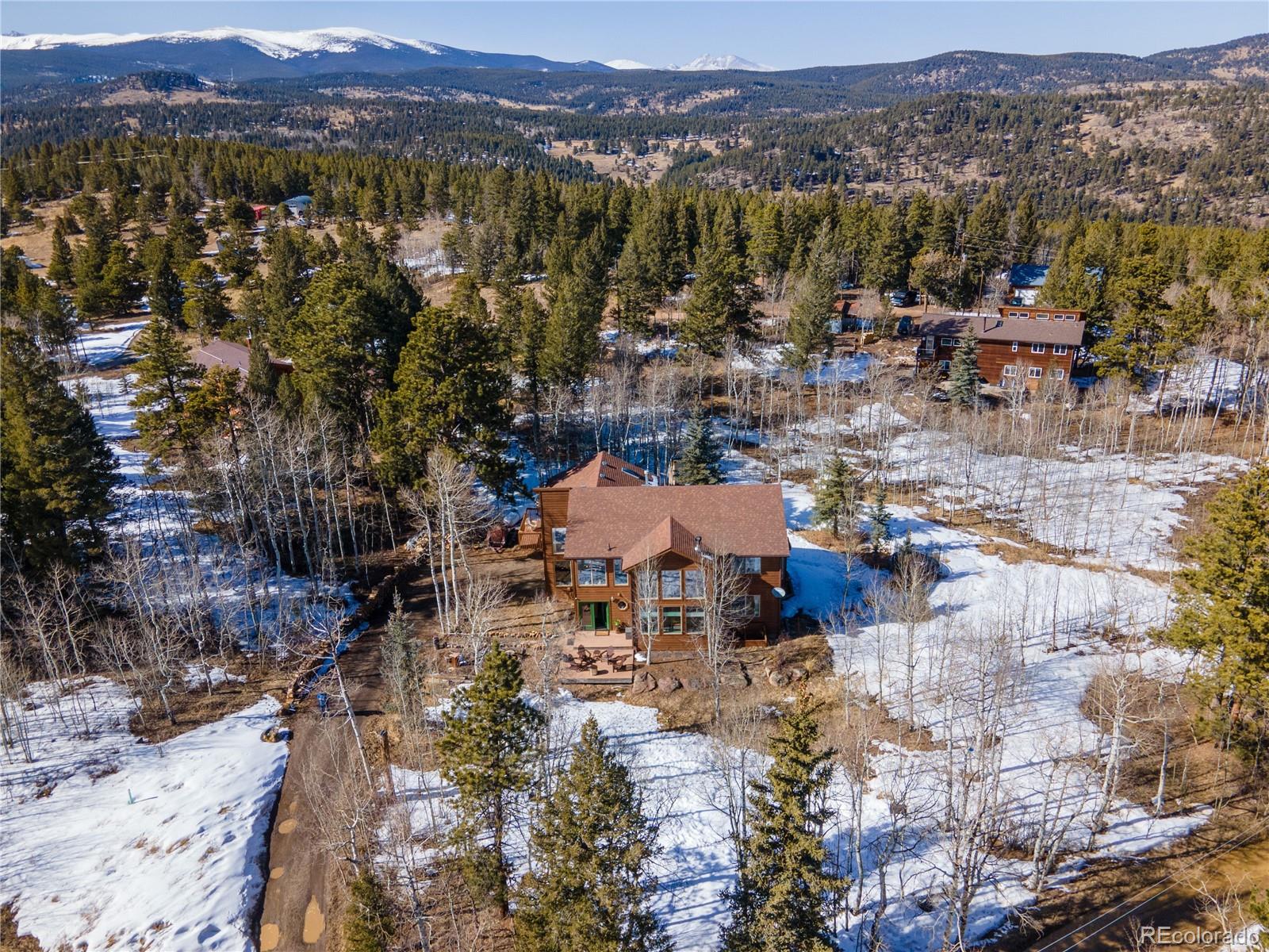 186 Thunder Ridge Road South Nederland, CO 80466 - Photo 9 of 50 a view of a city with lots of trees