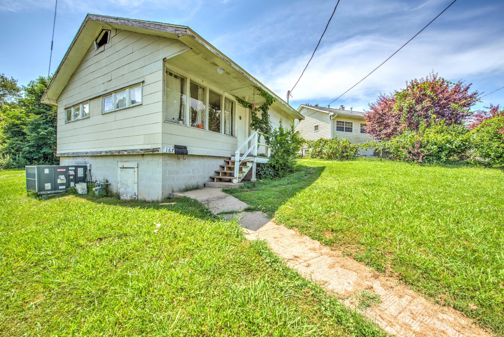 167 Johnson Road Oak Ridge, TN 37830 - Photo 1 of 15 a backyard of a house with table and chairs