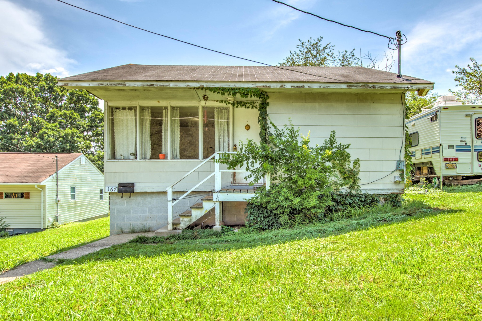 167 Johnson Road Oak Ridge, TN 37830 - Photo 2 of 15 a view of a house with a backyard