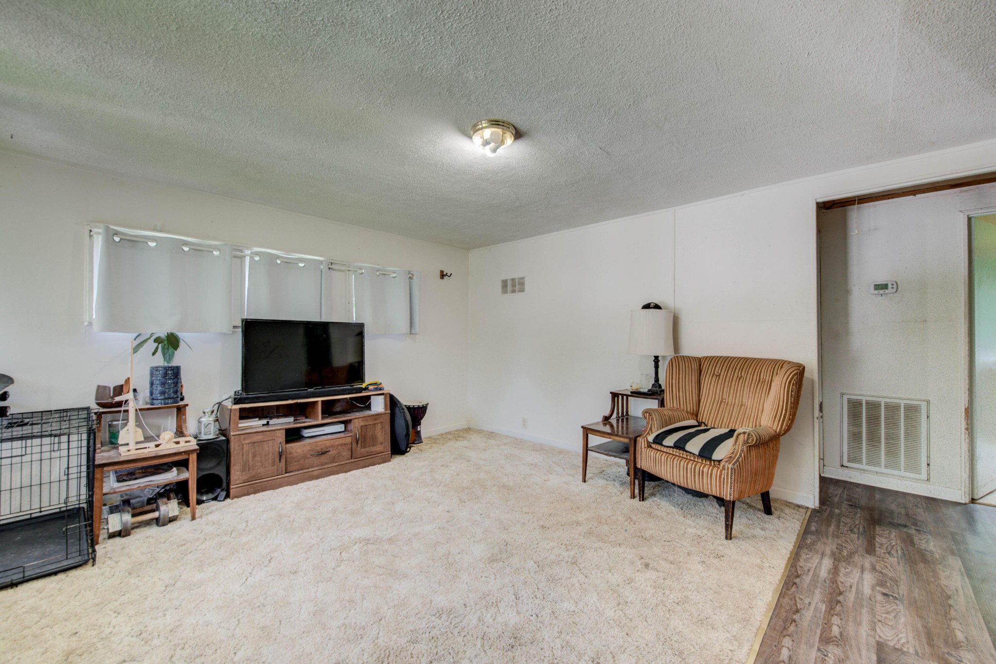 167 Johnson Road Oak Ridge, TN 37830 - Photo 6 of 15 a living room with furniture and a flat screen tv