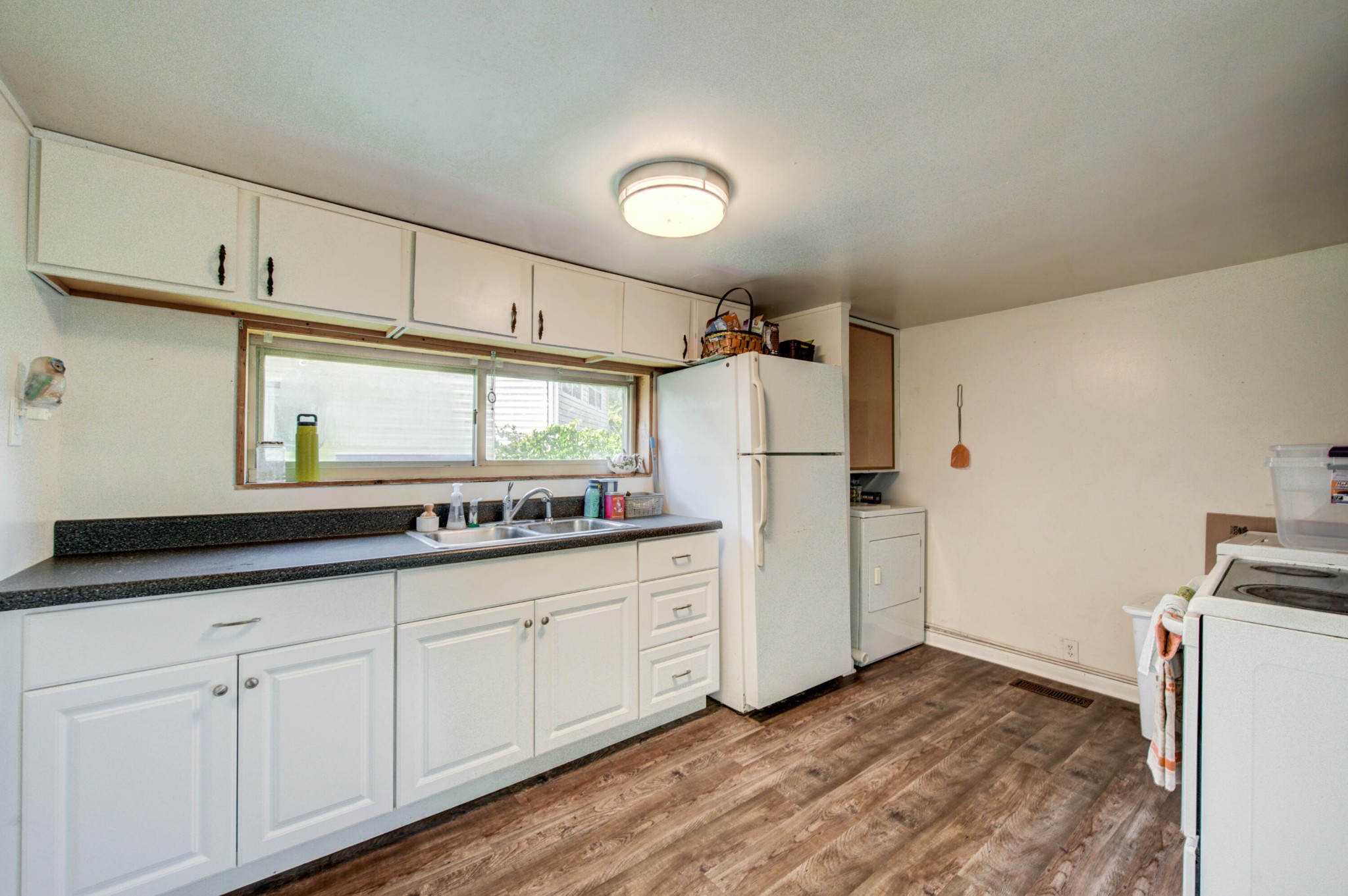 167 Johnson Road Oak Ridge, TN 37830 - Photo 8 of 15 a kitchen with cabinets and a refrigerator