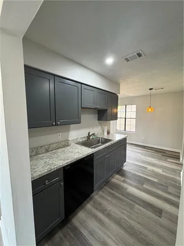 a large bathroom with a sink and a large mirror