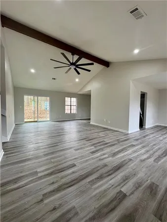 a view of room and wooden floor