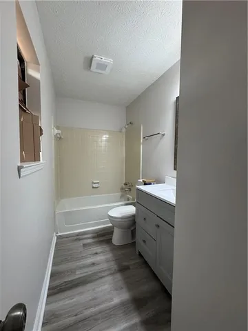 a bathroom with a toilet a sink and a bathtub