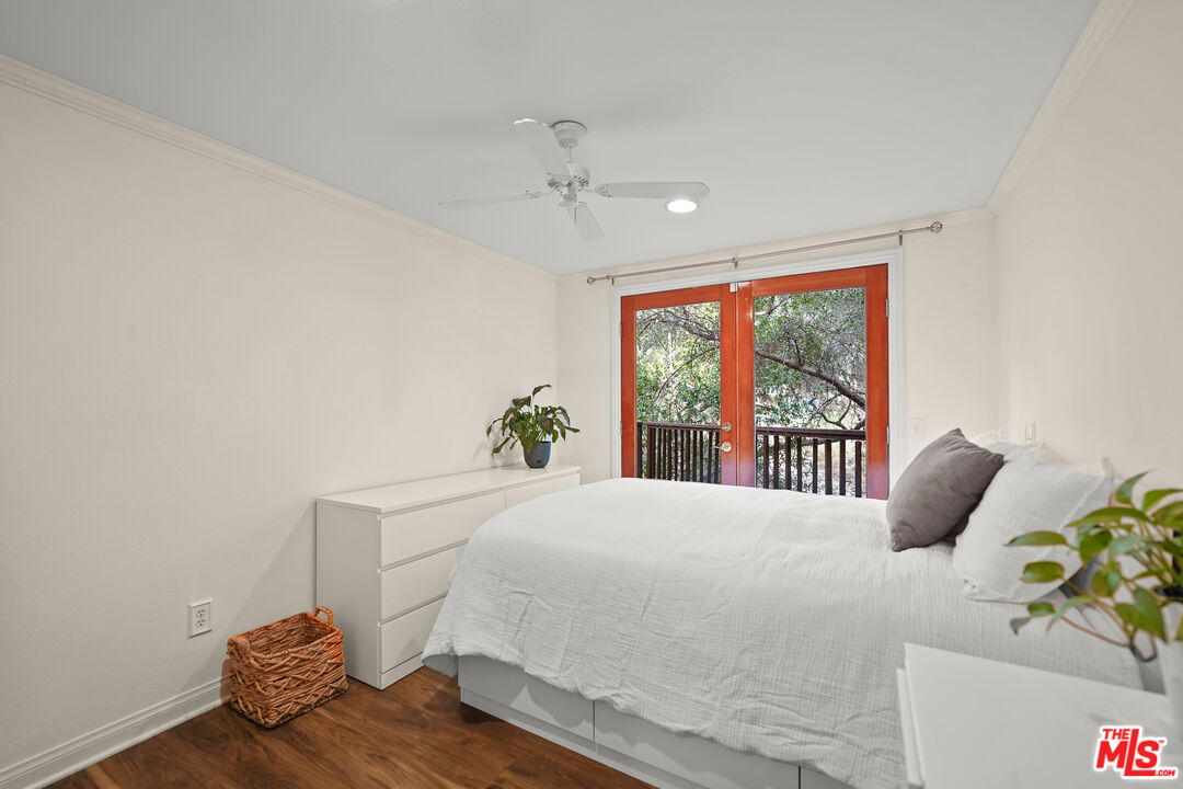 21545 Dome Trail Topanga, CA 90290 - Photo 17 of 23 a bedroom with a bed and a window
