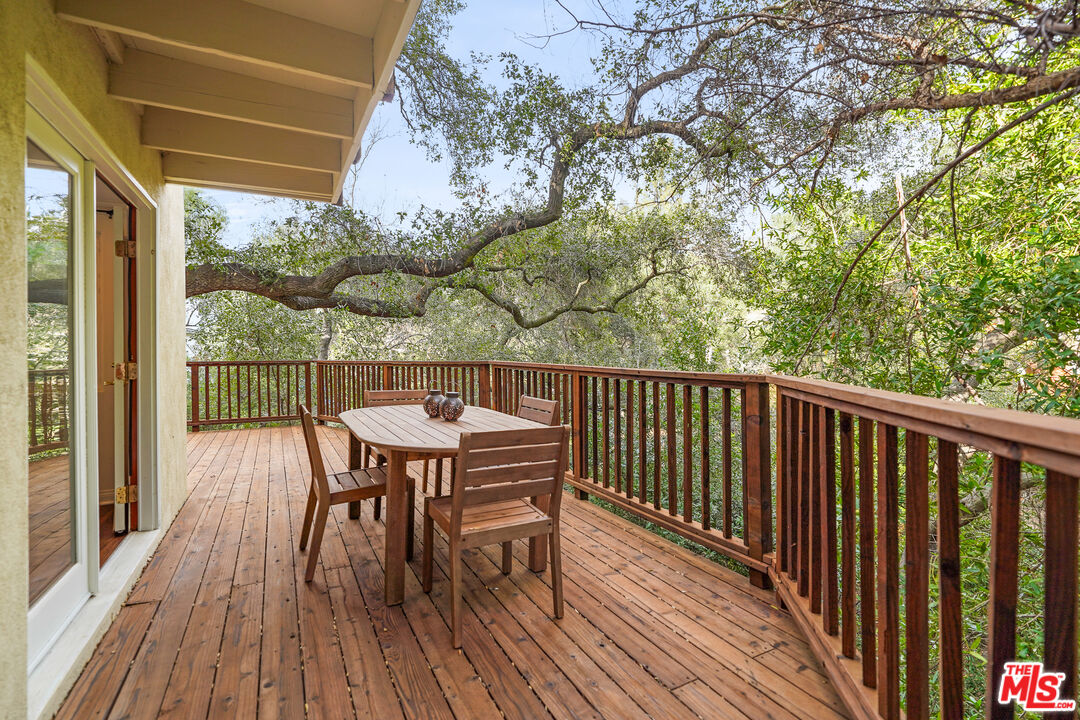 21545 Dome Trail Topanga, CA 90290 - Photo 9 of 23 a view of a wooden chairs on the roof deck