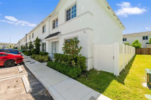 a view of a car parked in front of a building