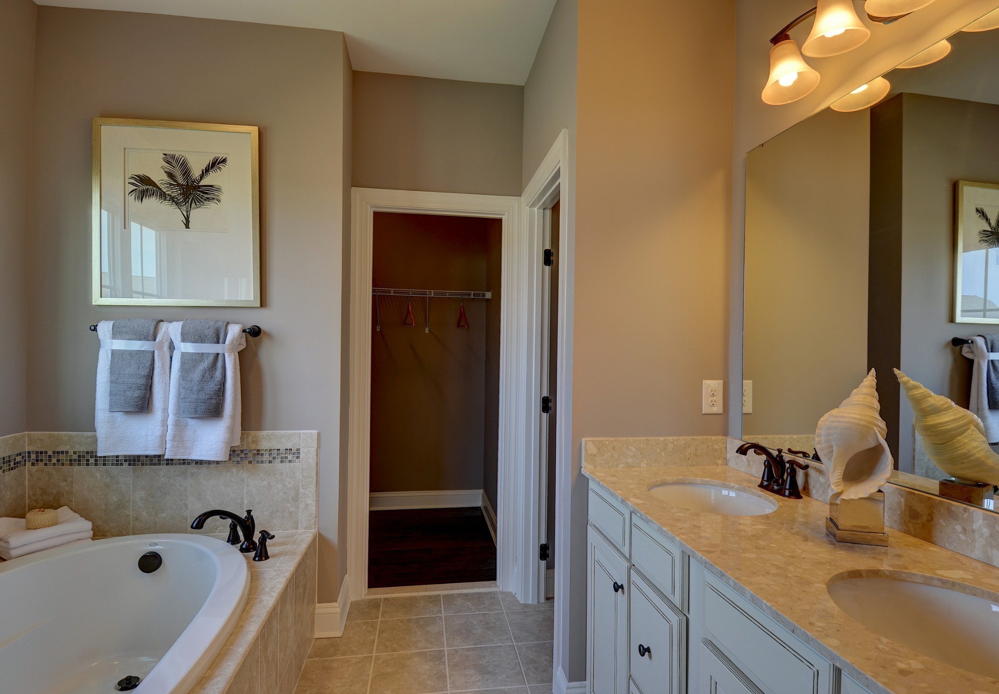 4020 Oglethorpe Drive Franklin, TN 37064 - Photo 9 of 14 a bathroom with a tub sink and mirror