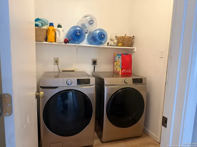 a utility room with dryer and washer