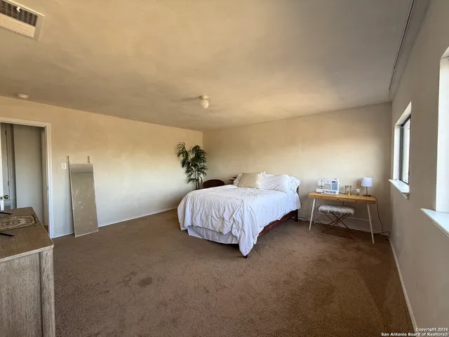 a bed room with a bed and furniture