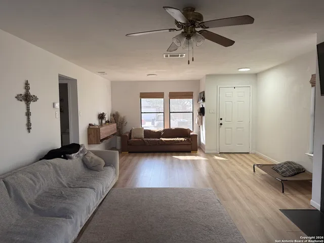 a living room with furniture and a window