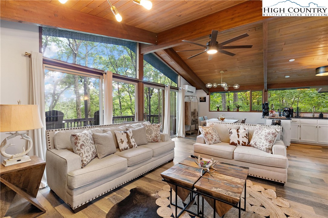 139 Club House Road Beech Mountain, NC 28604 - Photo 1 of 44 a living room with furniture and a large window