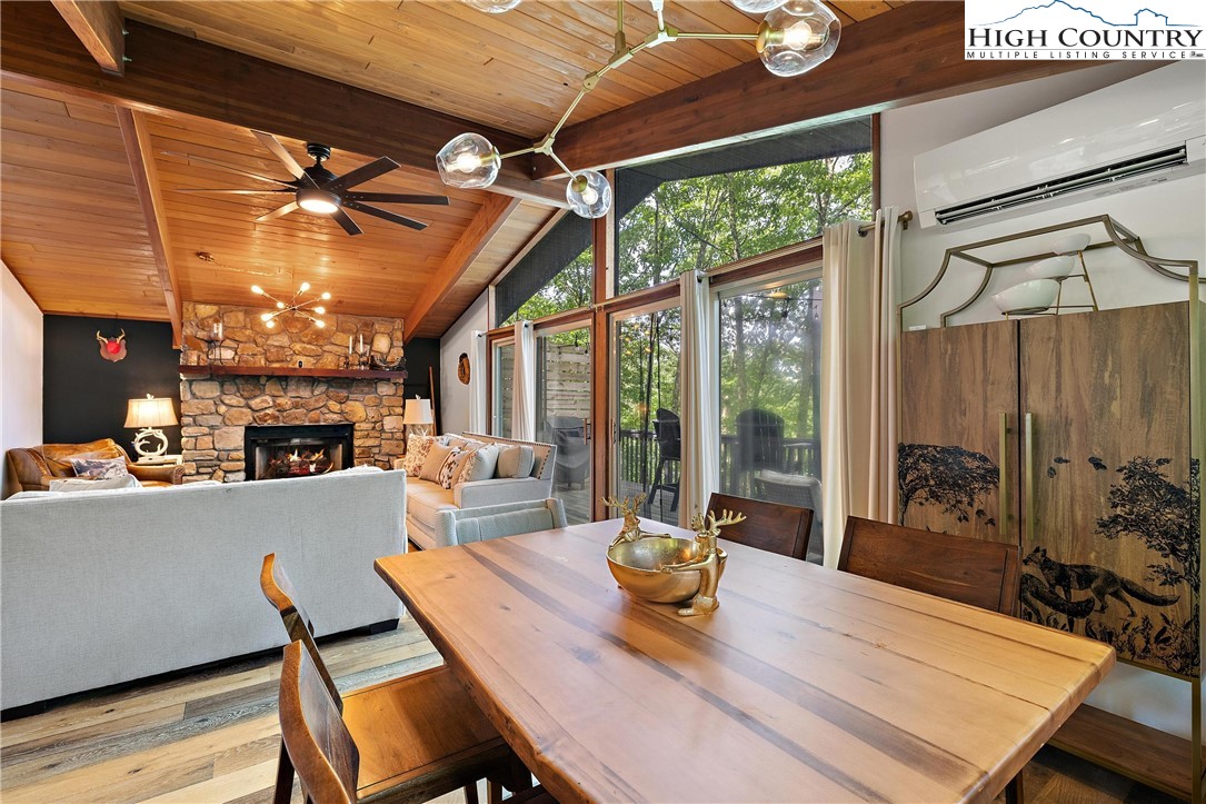 139 Club House Road Beech Mountain, NC 28604 - Photo 11 of 44 a view of a dining room with furniture window and outside view