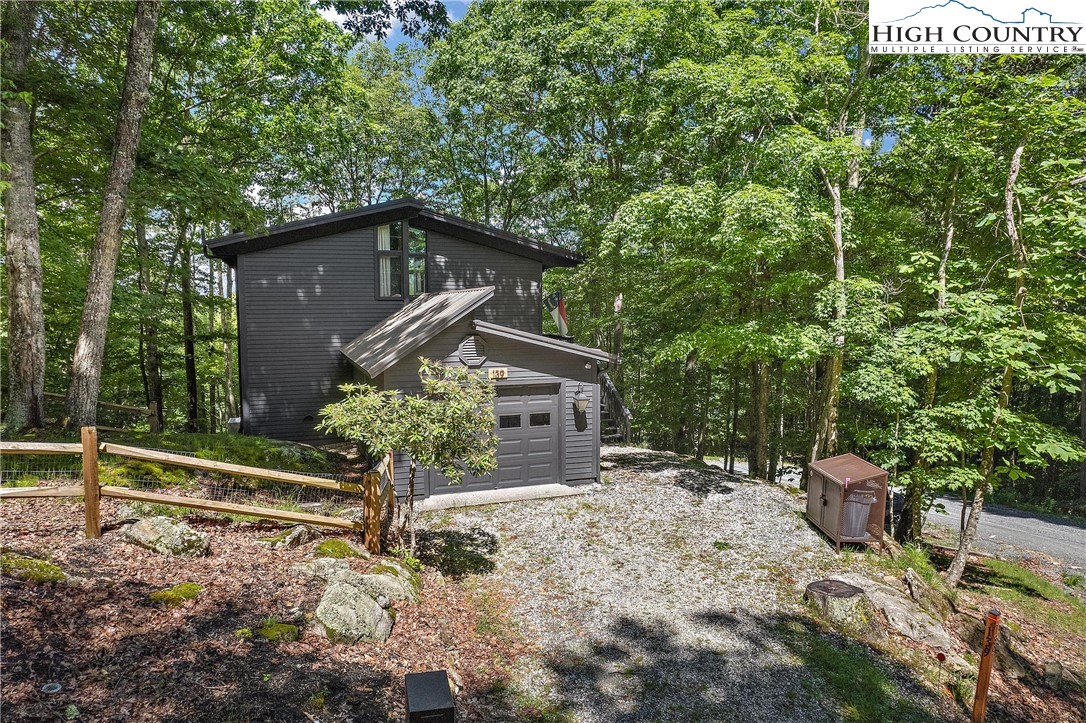 139 Club House Road Beech Mountain, NC 28604 - Photo 2 of 44 a house view with a outdoor space